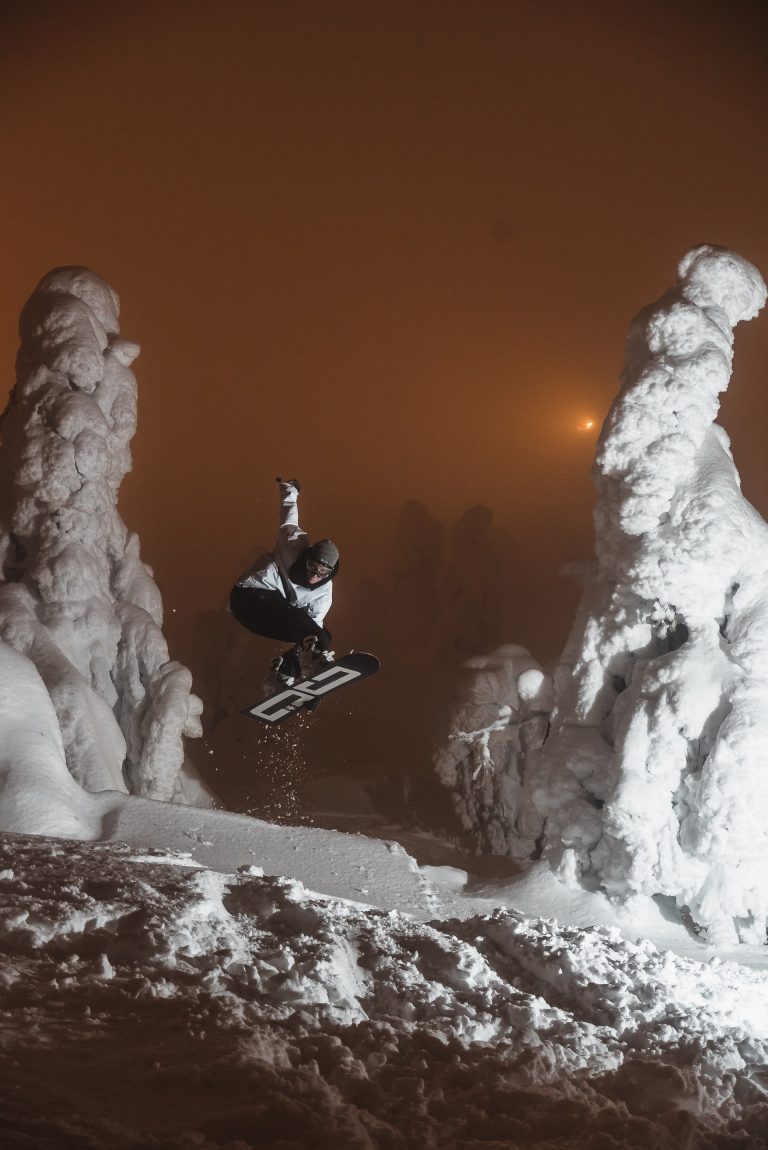 Powder Day Snowboarding through Snow Covered Trees