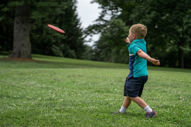Child Throwing Disc