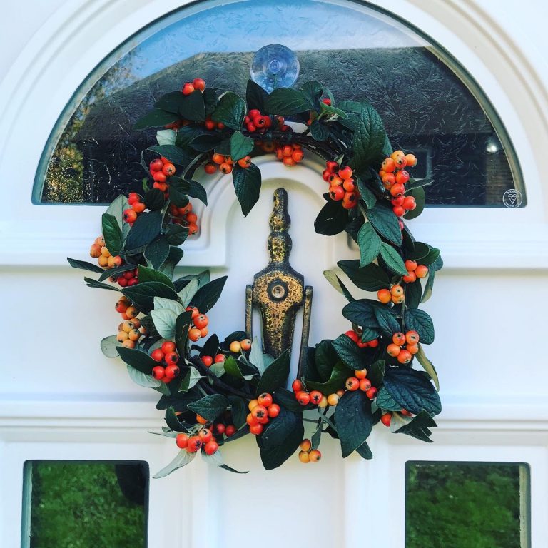 Autumn wreath made of Cotoneaster branches